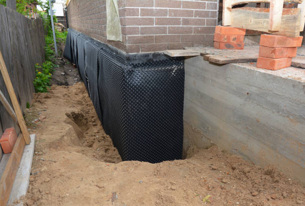 SJ Waterproofing Pros technician performing targeted Wet Basement Repair assessment in Rixeyville, VA
